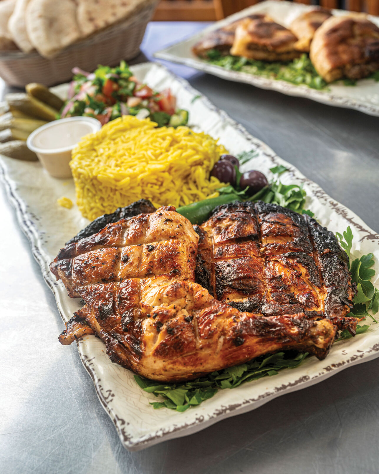 Half grilled chicken meal at Galilee